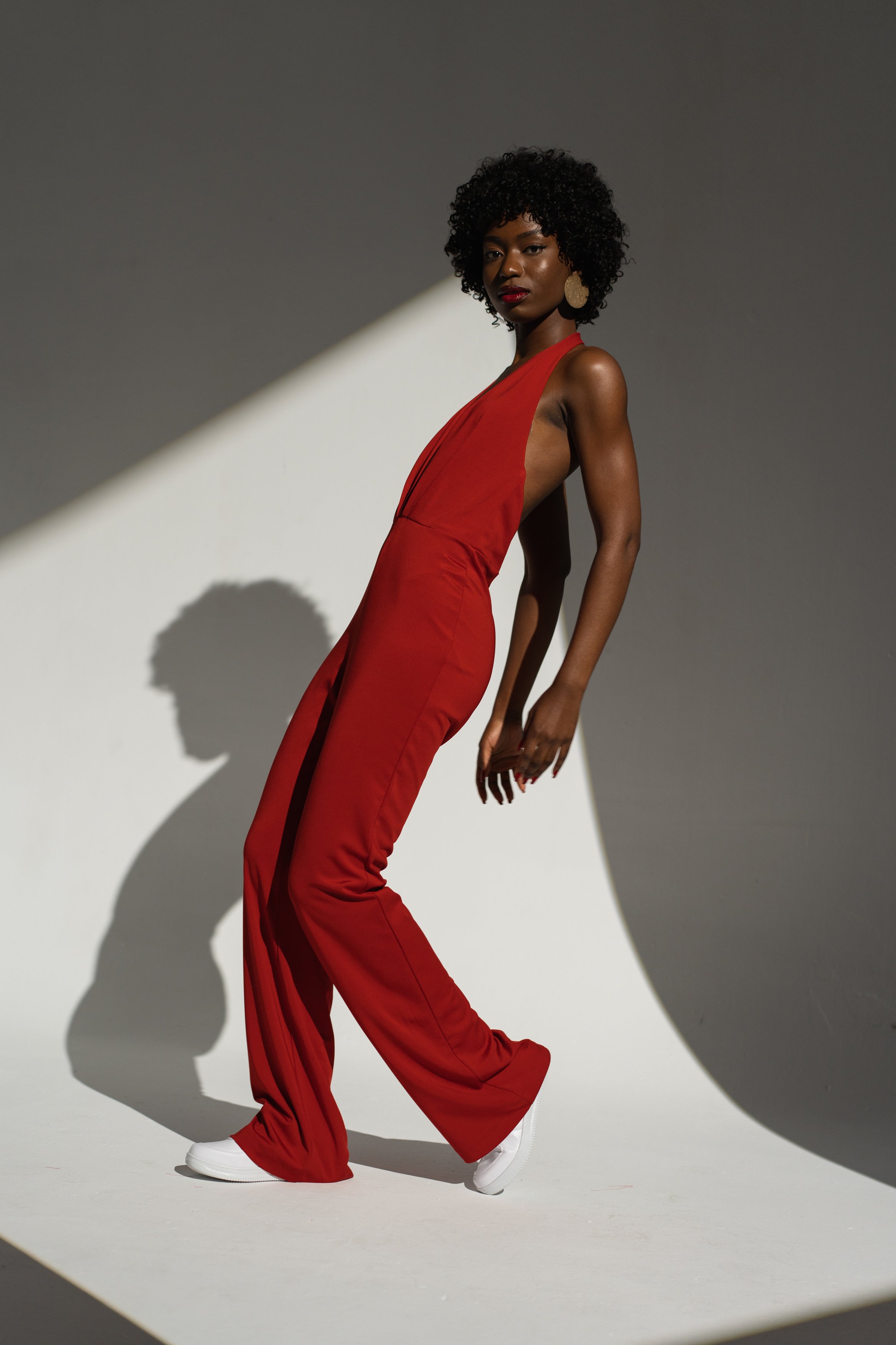 Fashionable Woman in Red Jumpsuit